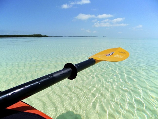 Paddling over a sandbar at Curry Hammock State Park